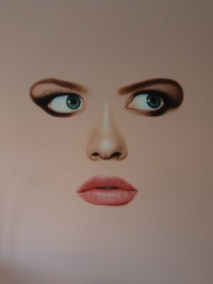 Modern face art featuring a surrealistic woman’s face with blue eyes and soft lips on a minimalist canvas.