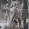 Black and white wall art of a vintage-inspired woman in a polka-dot bikini, reflected in mirrors, creating a striking effect.