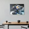 MotoGP canvas wall art in a sleek office environment with glass walls.