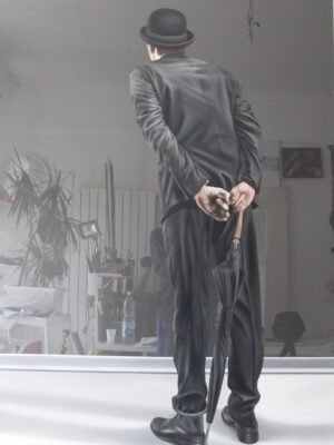 Surrealist art for sale – a dreamlike masterpiece featuring a mysterious figure in black with a bowler hat and umbrella.